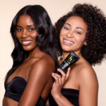 Black Girl Sunscreen® original SPF 30 lifestyle – Black woman wearing no white cast sunscreen outdoors