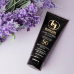 Model wearing Make It Matte™ SPF 45 by Black Girl Sunscreen® – matte finish sunscreen for Black women